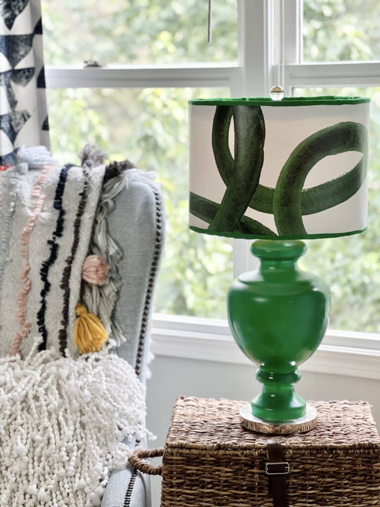 A lamp makeover using green and white wallpaper and green spray paint.