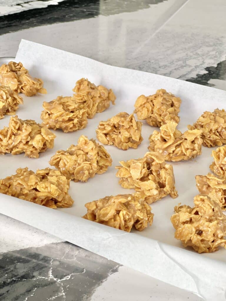cereal cookie recipes: peanut butter corn flake cookies on a baking sheet.