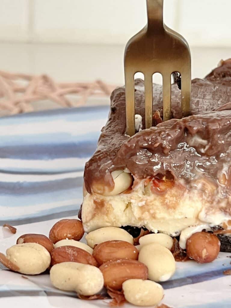 A gold fork sticking out of a piece of the Buster Bar recipe.