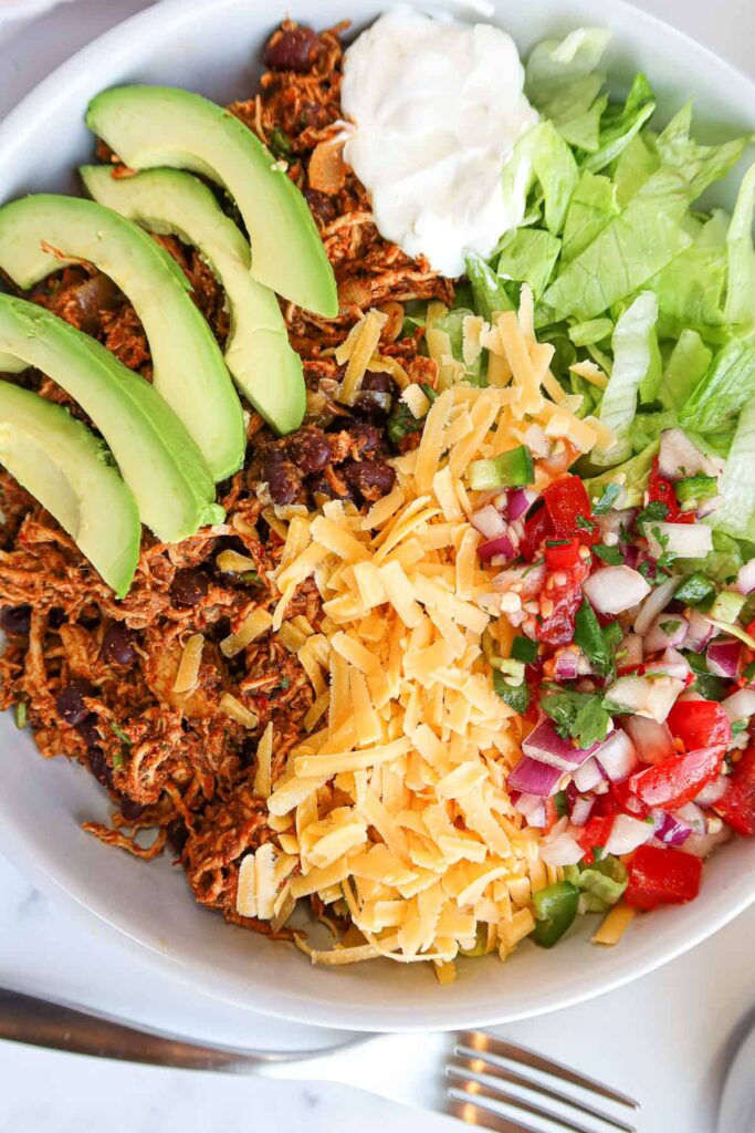 Healthy Mexican Salad Recipes: A shredded chicken taco salad. Garlic, Salt, and Lime Blog.