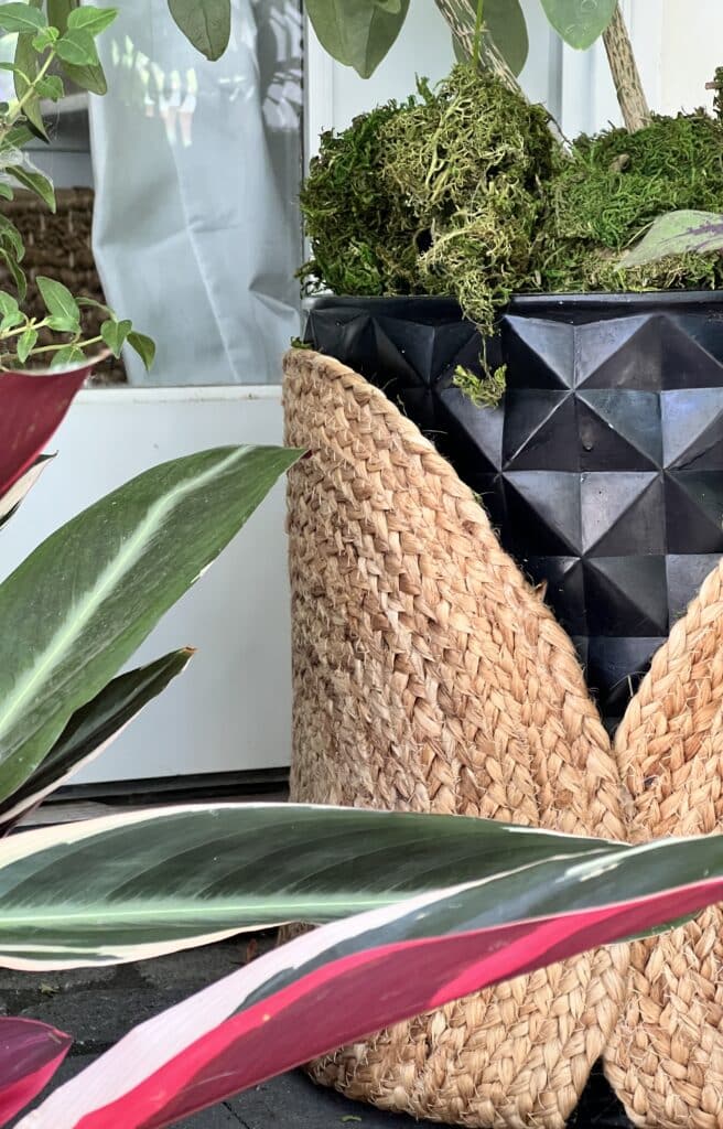 Jute placemats wrapped around a black planter pot.