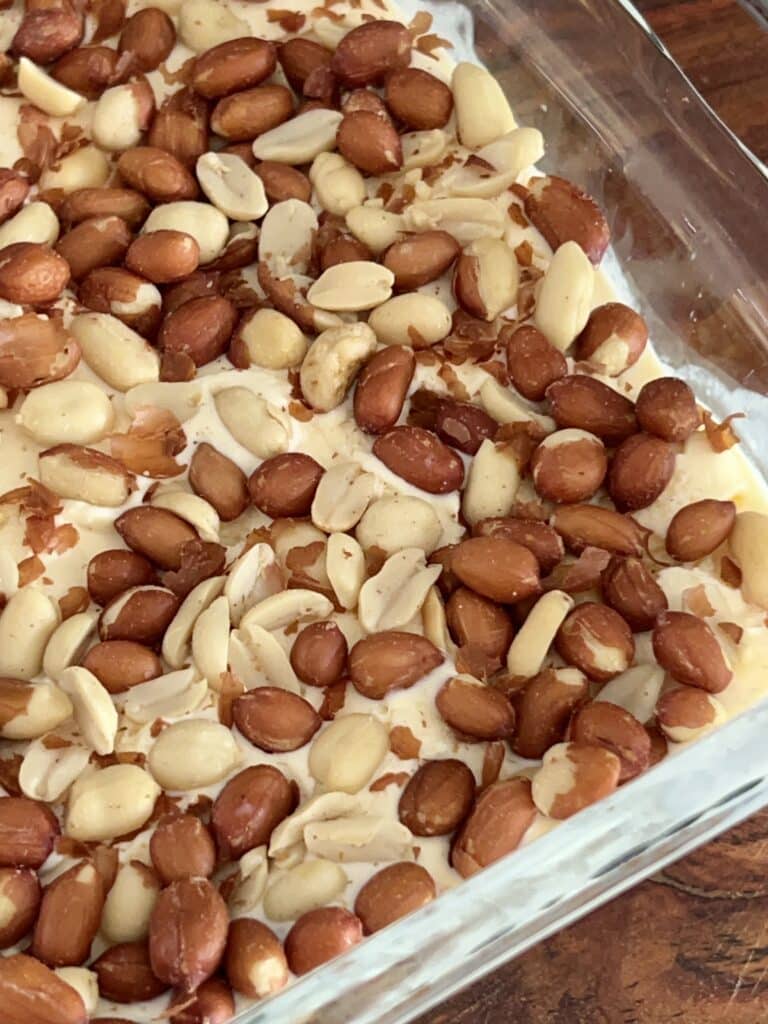 A layer of Spanish peanuts pressed into the ice cream layer of this Buster Bar recipe.