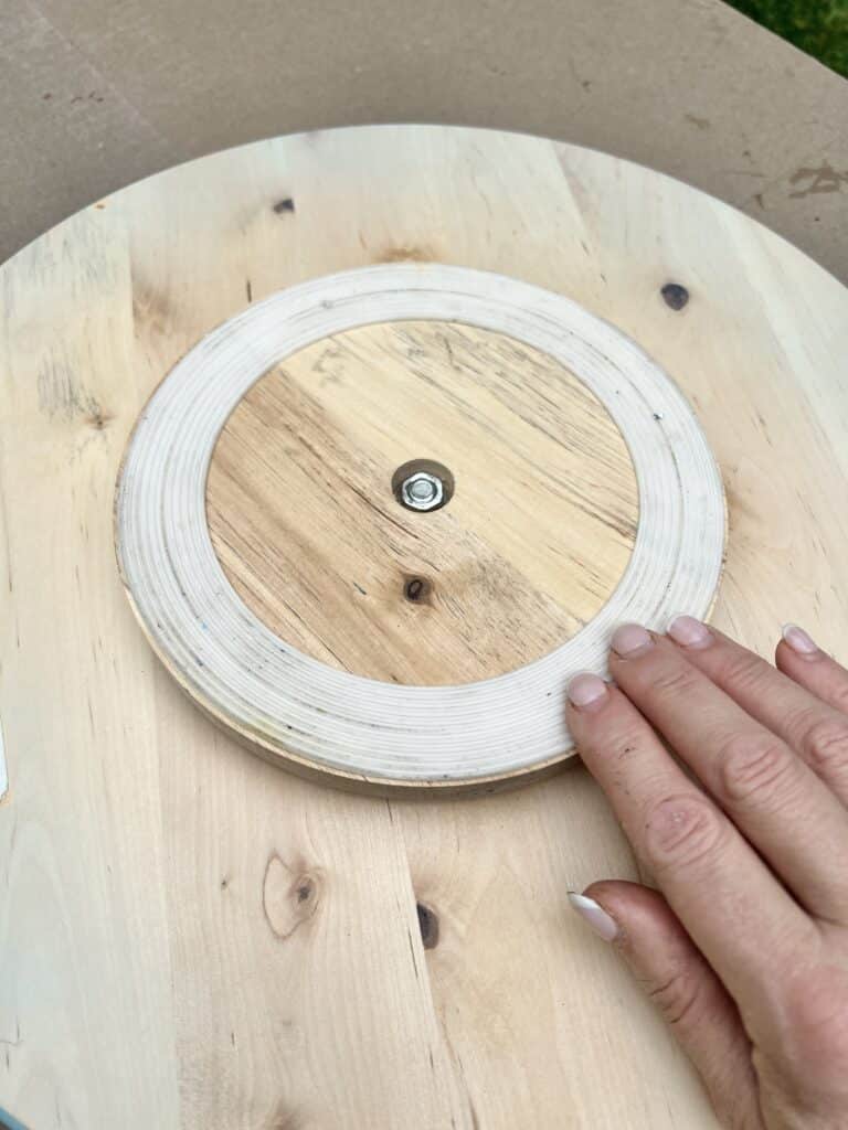 The underside of a thrifted Lazy Susan.