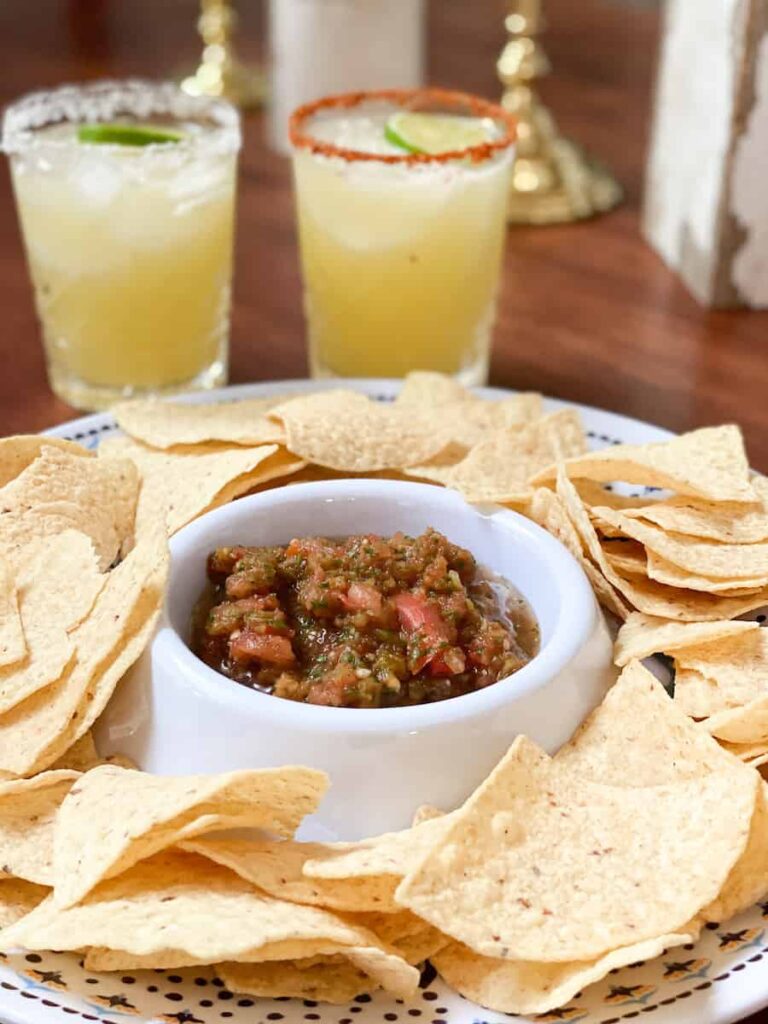 A bowl of homemade salsa with chips and margaritas. Living Large in a Small House Blog