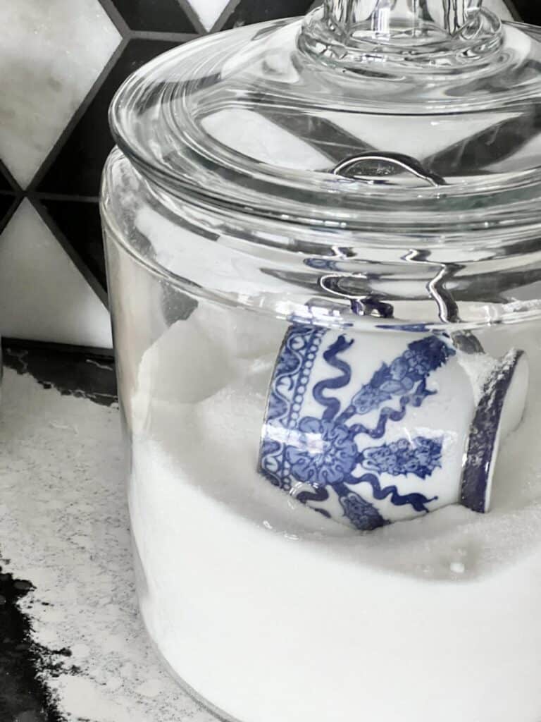 A-Glass-Canister-holding-sugar-and-a-blue-and-white-teacup-Sonata-Home-Design-1536x2048