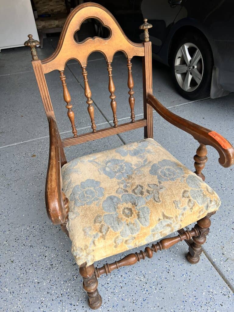 A thrift store chair that needs a new upholstered seat.