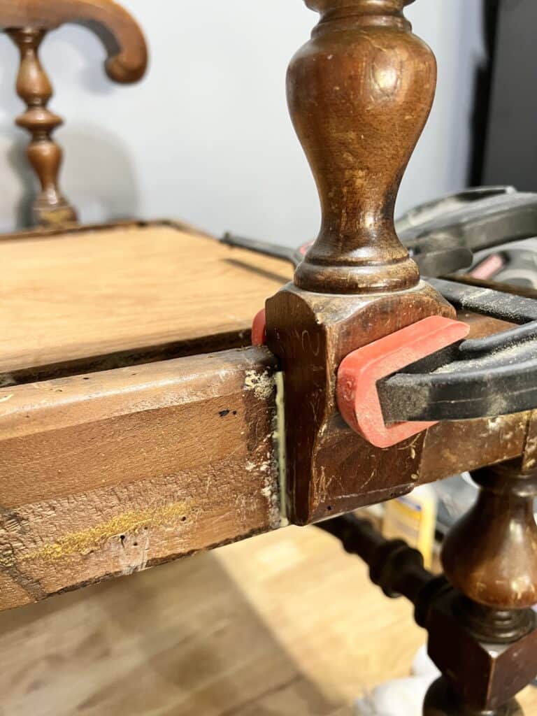 Repairing a broken wood chair.