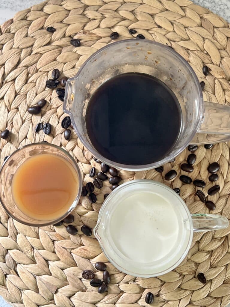 The ingredients for a butterscotch latte recipe that includes coffee, cream, and butterscotch topping.