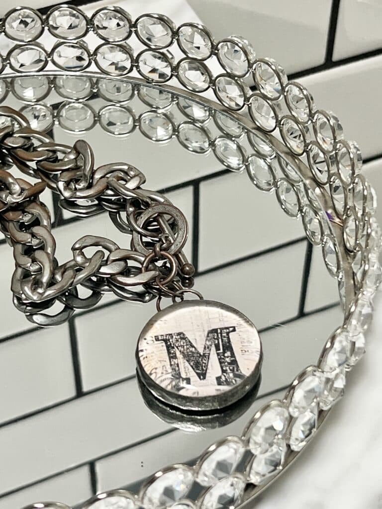 A chunky monogram necklace.