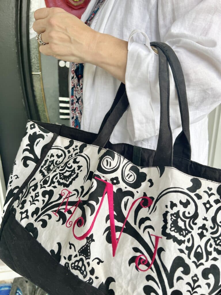 Ideas for How to Wear Monogrammed Clothing with Style: a tote bag with a pink monogram.