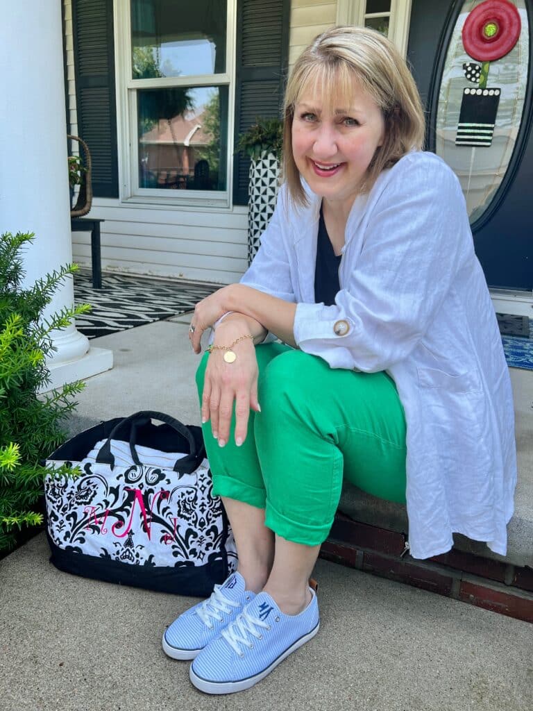 Missy with a monogrammed bag, bracelet, and shoes.