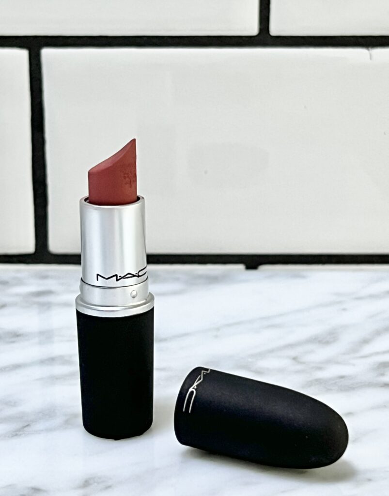 the benefits of a lip scrub: A tube of red lipstick.