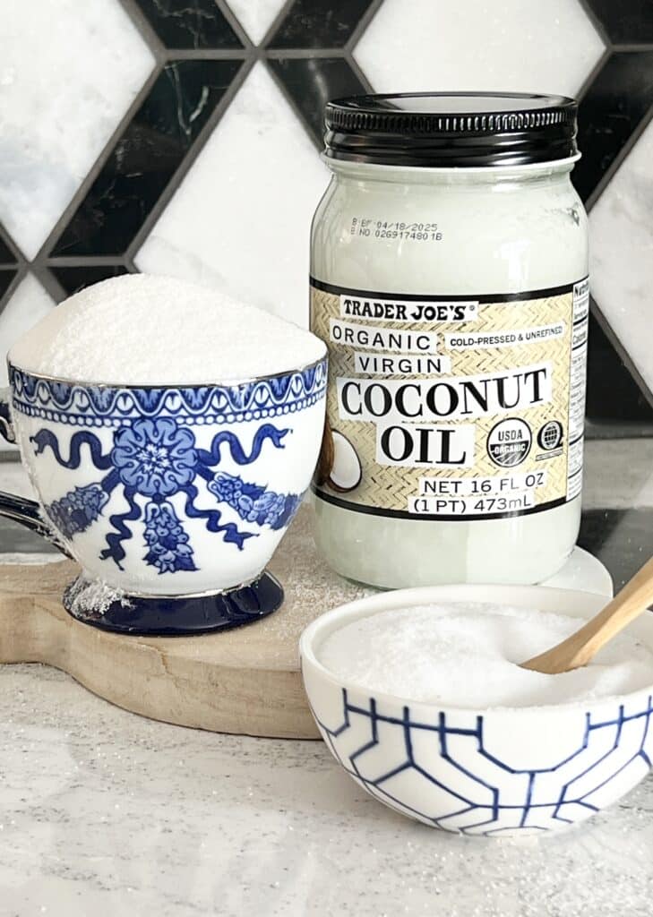 Benefits of lip scrub: A jar of coconut oil, a cup of sugar, and a bowl of salt.