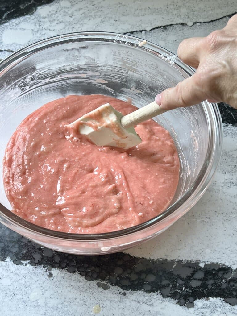 3 ingredient strawberry cake cookies: Stirring the cookie batter with a rubber spatula.