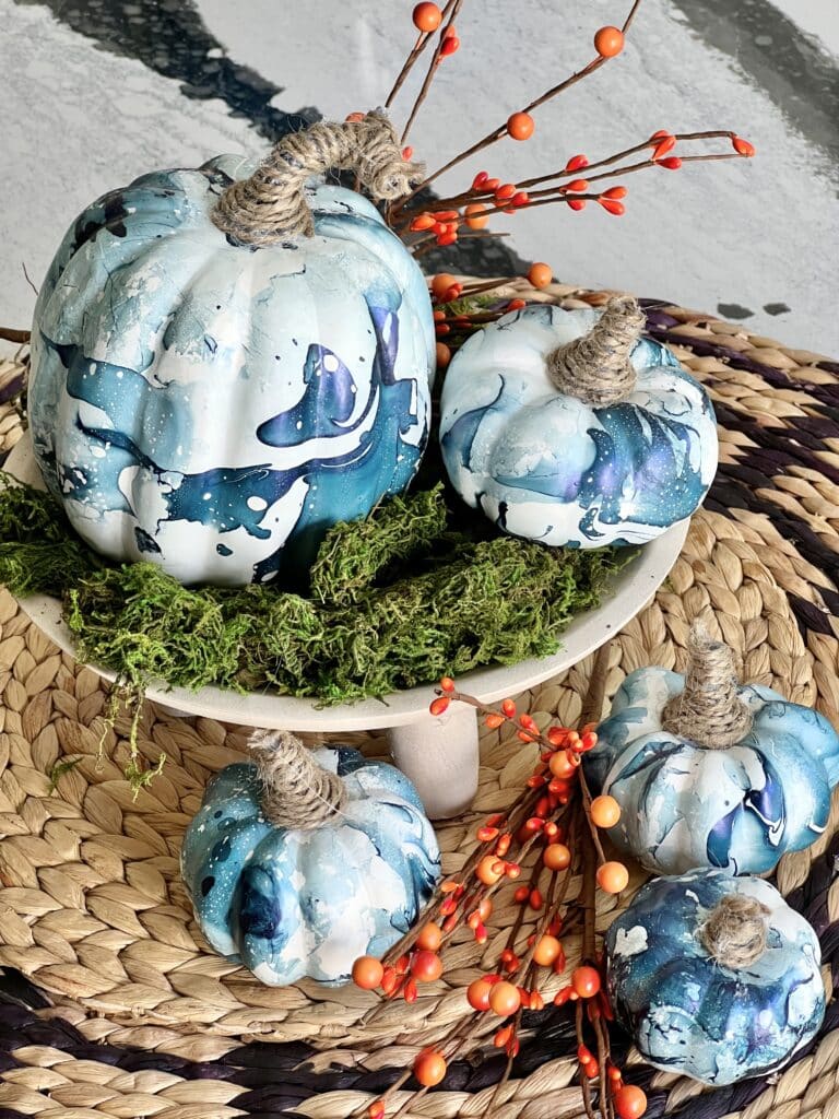 DIY pumpkins that have been painted with nail polish.