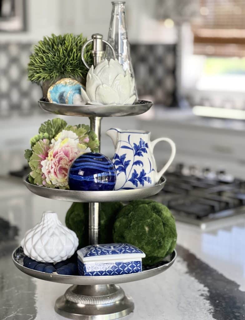 everyday table centerpiece ideas: A decorated tiered tray on a kitchen island.