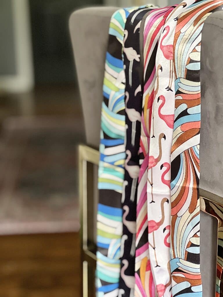 how to tie purse scarf: Twilly scarves draped on a chair.