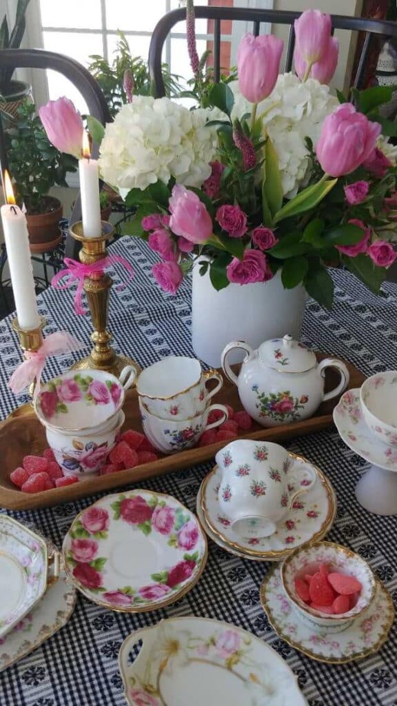 Teacups displayed in a dough bowl on a table.