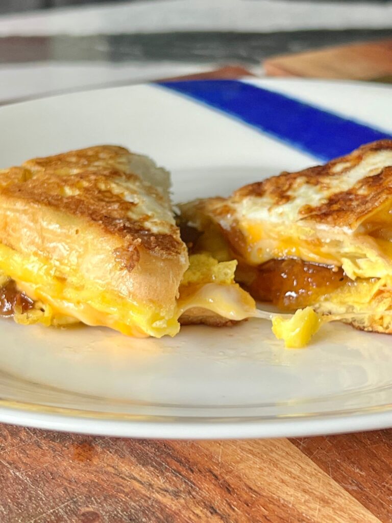 A one pan breakfast sandwich cut in half.