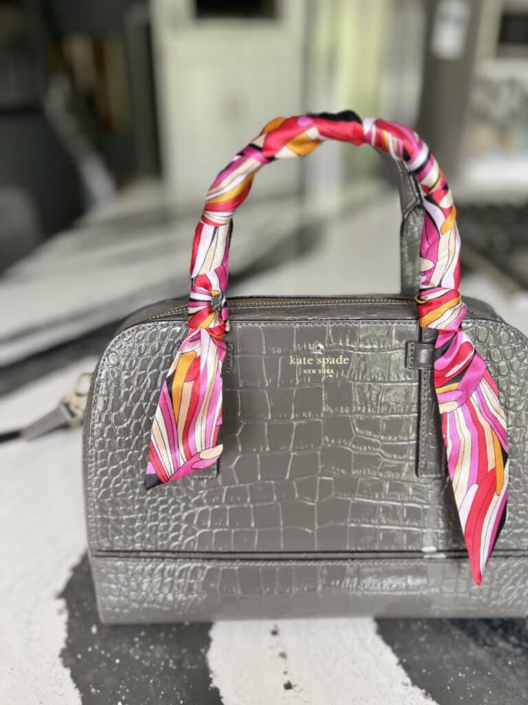 how to tie purse scarf: A wrapped purse handle using aa twilly scarf.