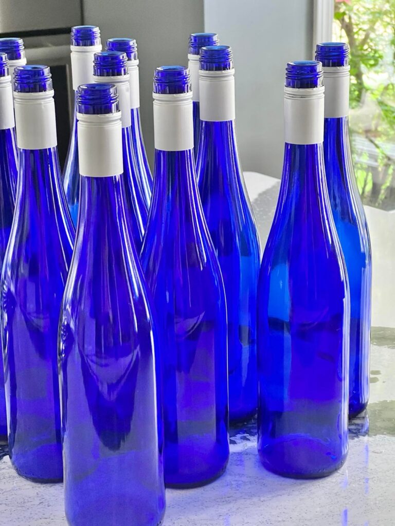 how to make wine  labels: a grouping of blue wine bottles