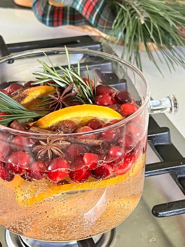 simmer pot recipes: A Christmas simmer pot bubbling on a stovetop.