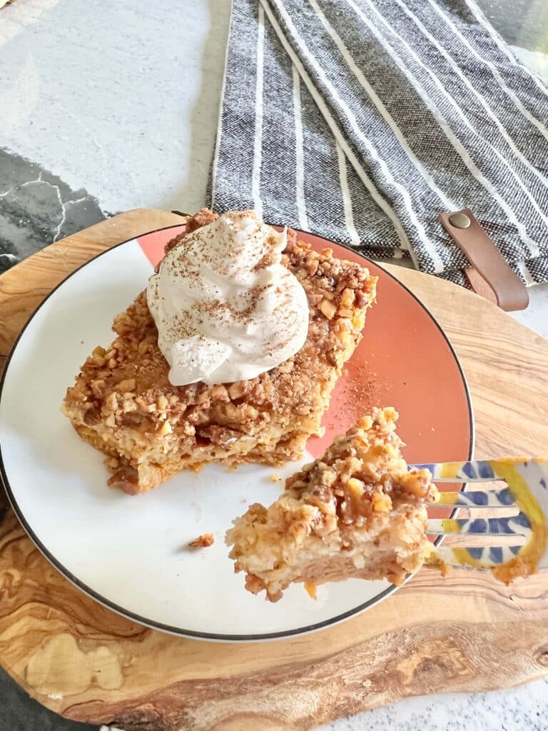 Eating pumpkin pie crunch cake with a fork.