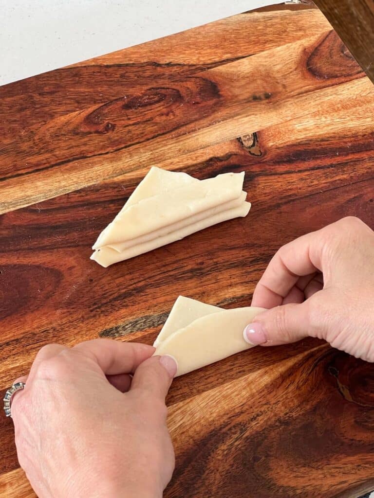 fall cookie recipe: folding pastry quarters in half.