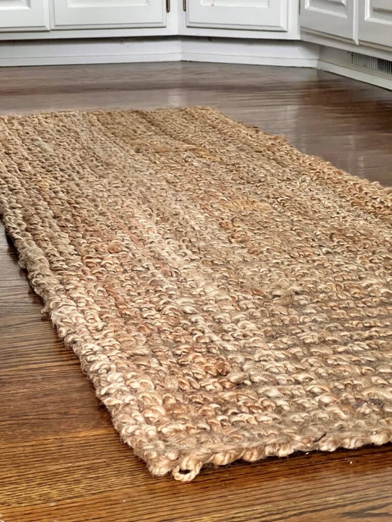how to clean a jute rug: A jute rug on the kitchen floor.