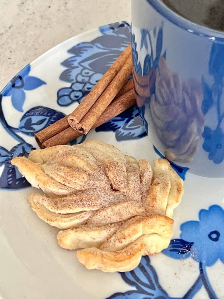 A leaf shaped cookie on a plate.