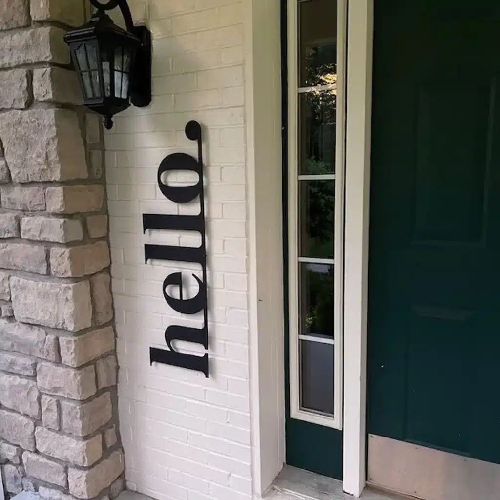 A metal "hello" sign for the front entry.