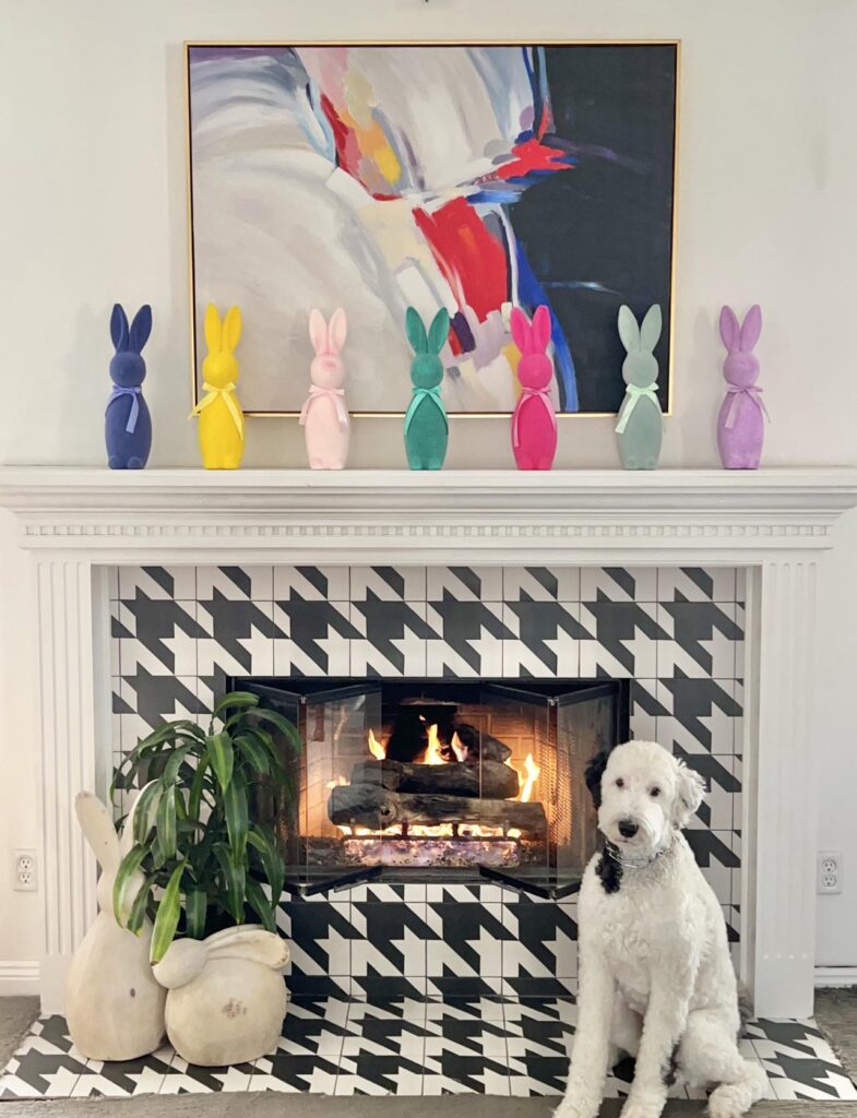 Colorful bunnies on the fireplace mantel.