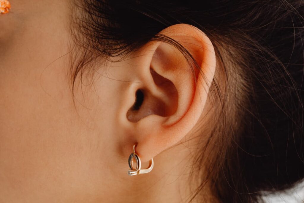 why do my ears hurt when i wear earrings? A huggie hoop earring.