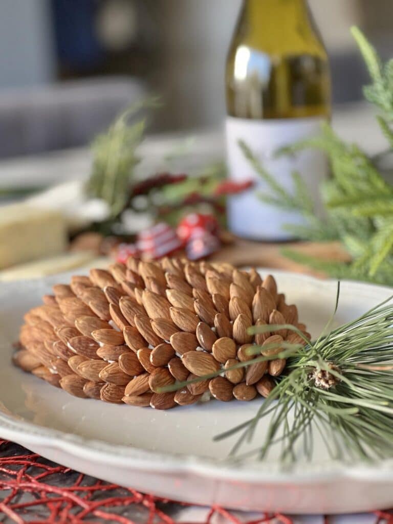 A holiday cheese ball recipe covered with almonds.