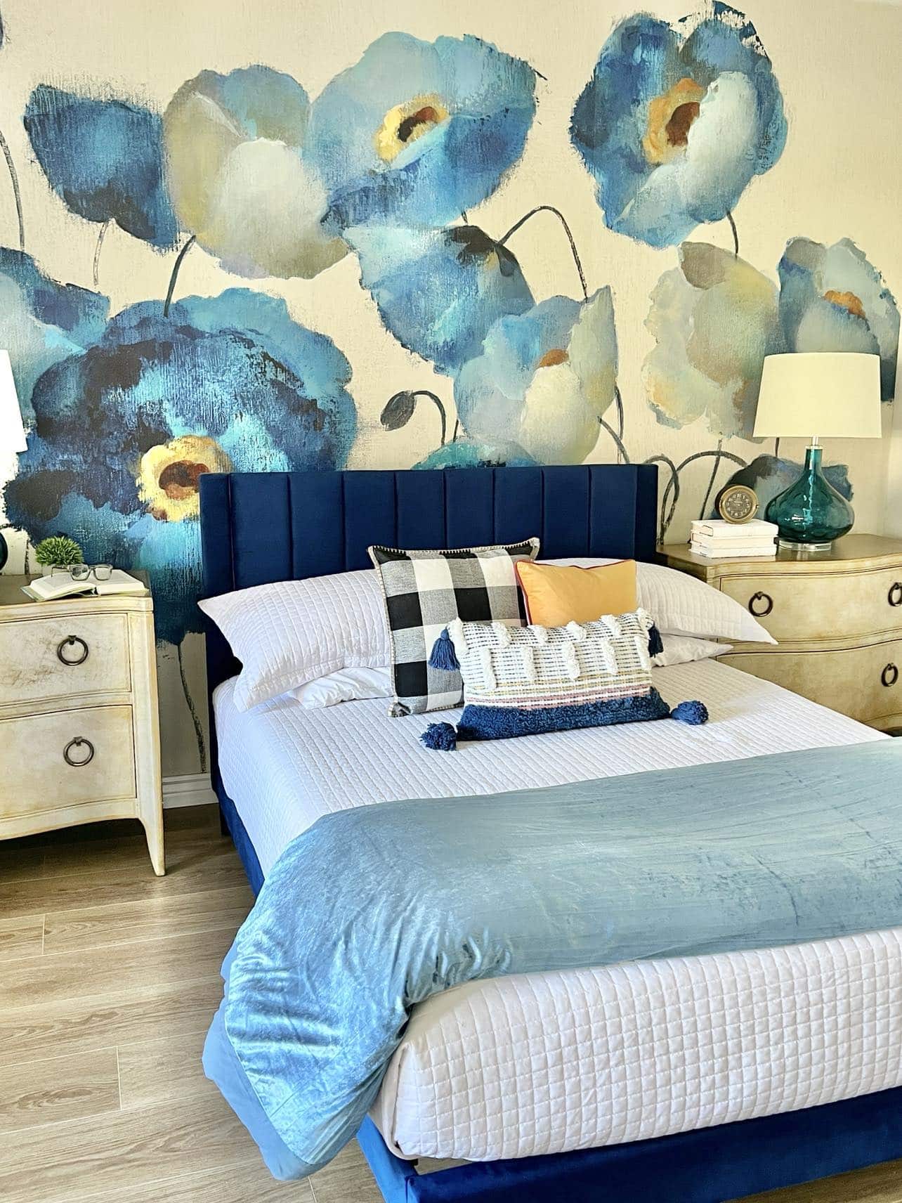 A floral wall mural on a bedroom wall.