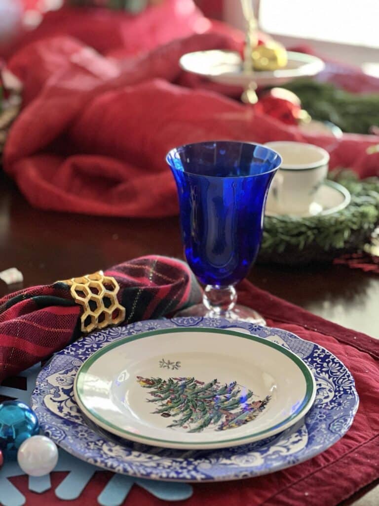 Can you put Spode Christmas tree dishes in the dishwasher? A Spode dessert plate on a blue and white dinner plate.