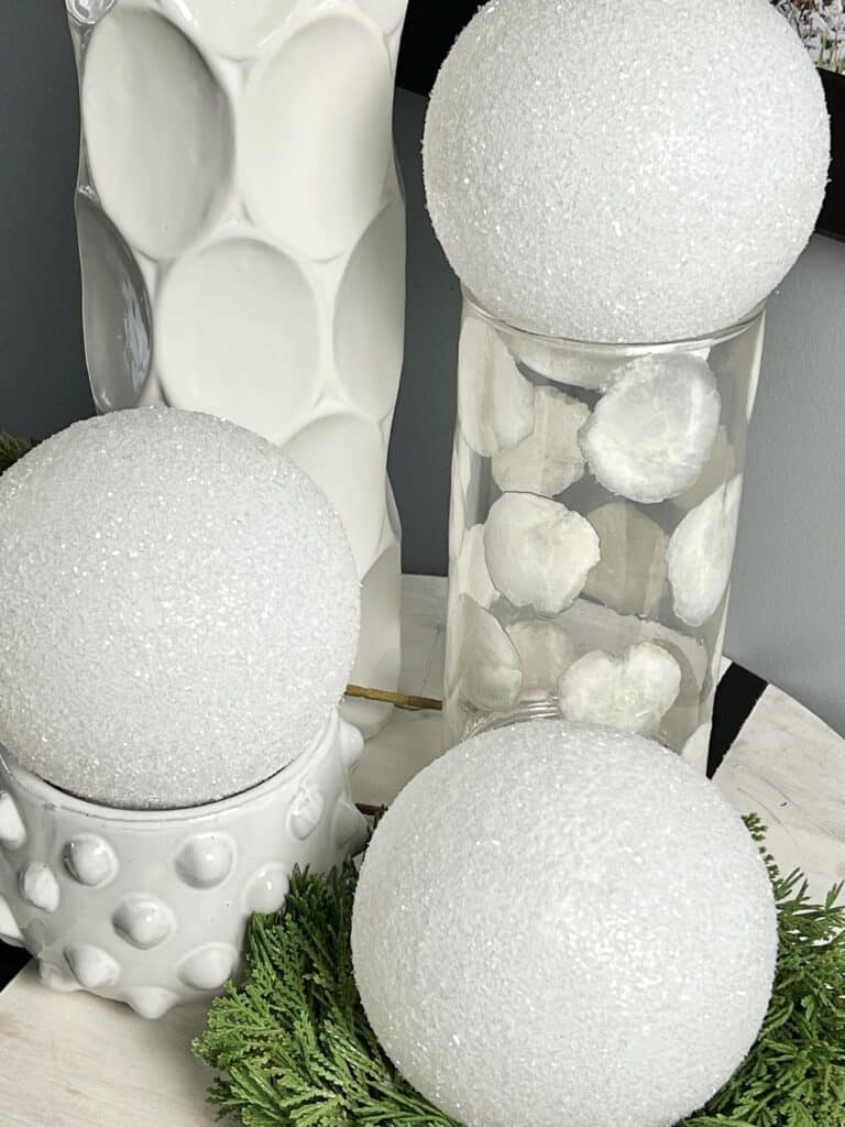 DIY glass snowballs displayed as a centerpiece.