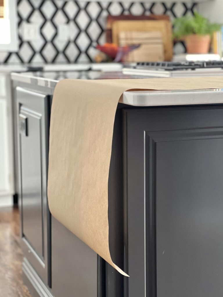 A piece of brown craft paper laid on a kitchen island as part of DIY valentine table decorations.