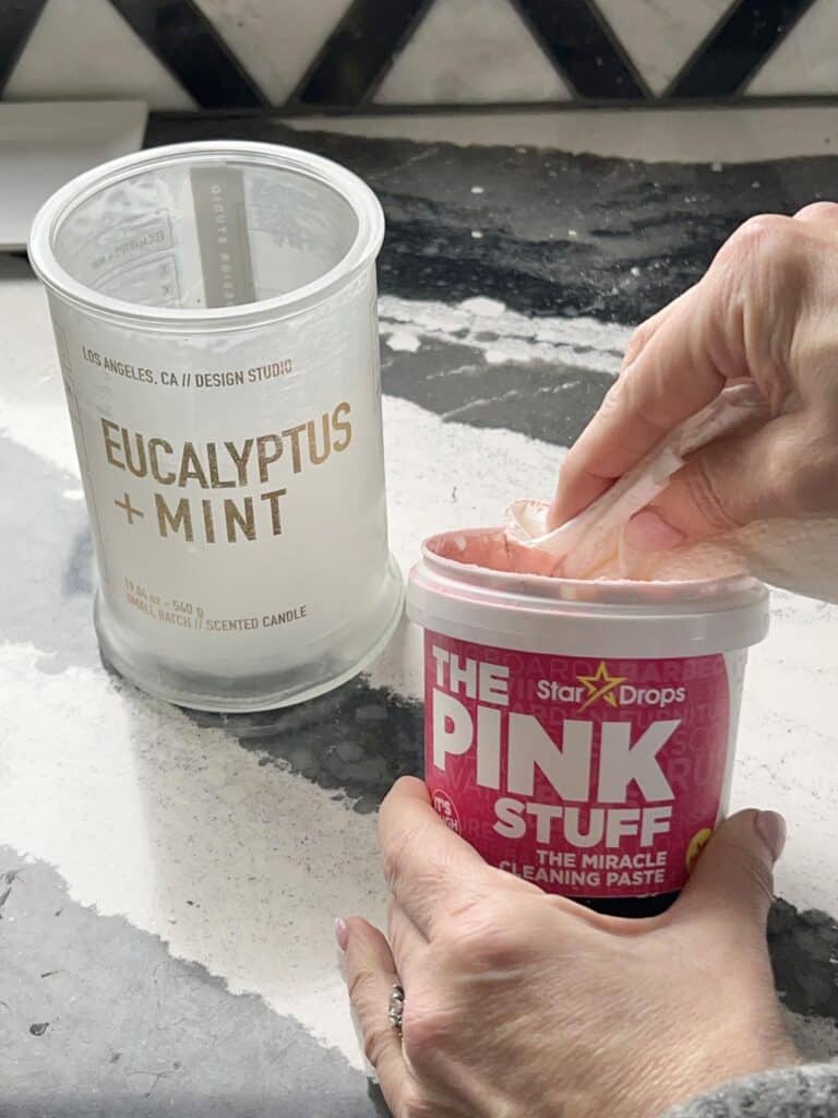 Using a product called "The Pink Stuff" to remove wax residue from aa jar candle.