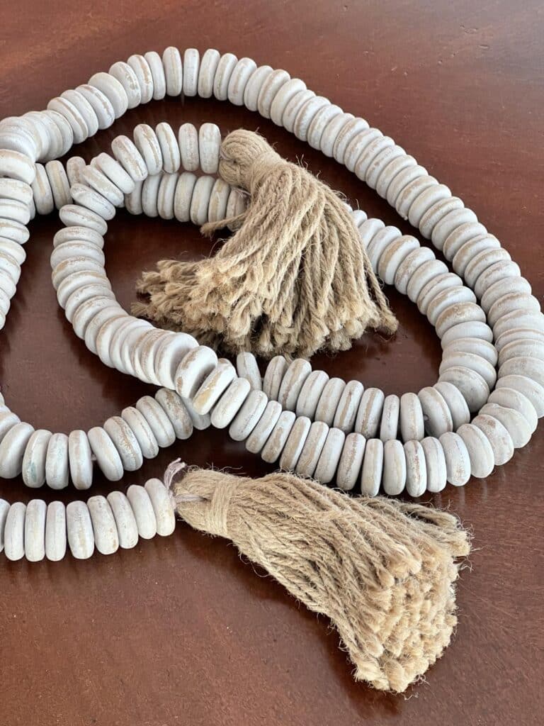 A wood bead garland with jute tassels.