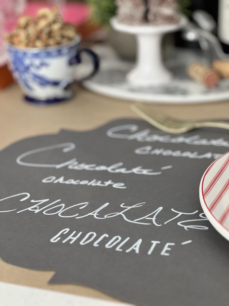 Decorating for 
Valentine's Day with placemats written with the word "Chocolate"