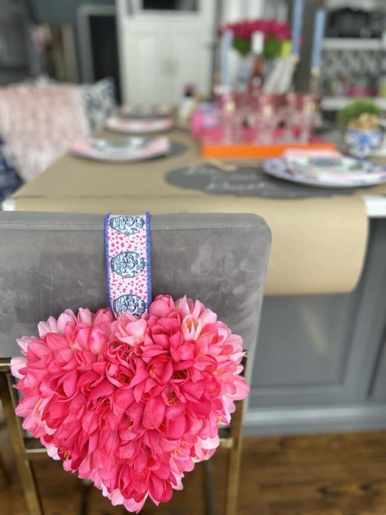 DIY valentine table decorations that include a tulip covered styrofoam heart.