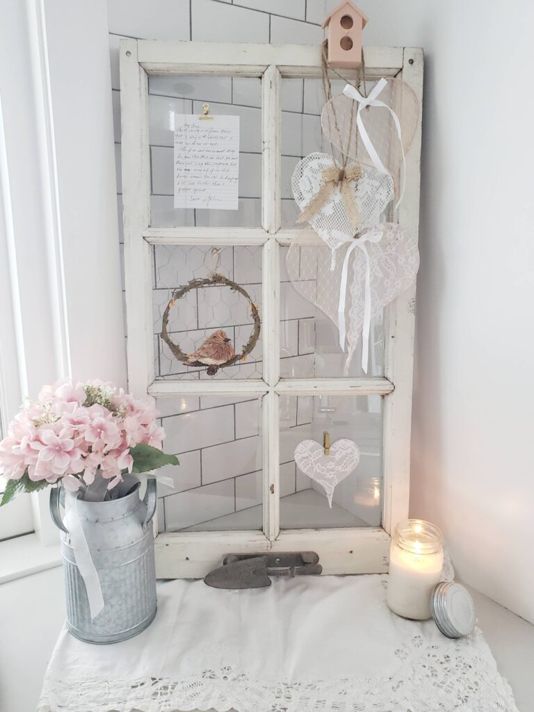 A vintage window filled with romantic memorabilia.