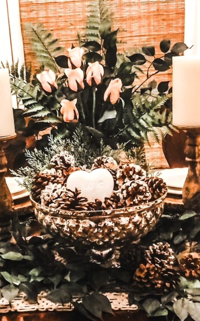 A table centerpiece with a white heart in the center.