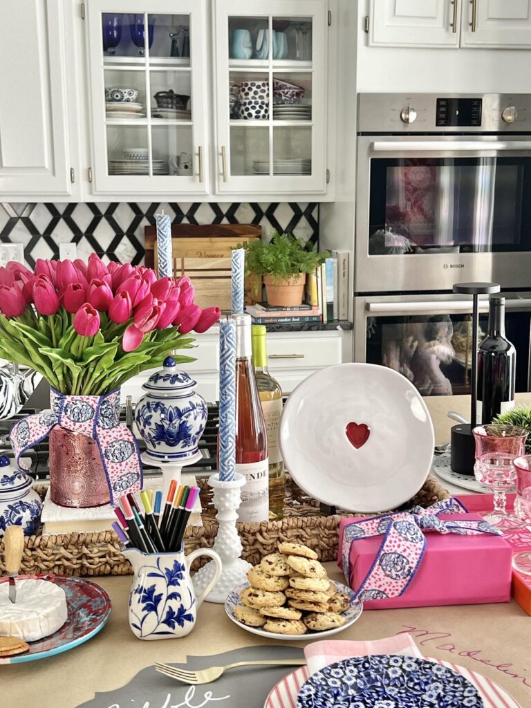 A centerpiece and place setting on a DIY paper table runner on which guests can draw and write.