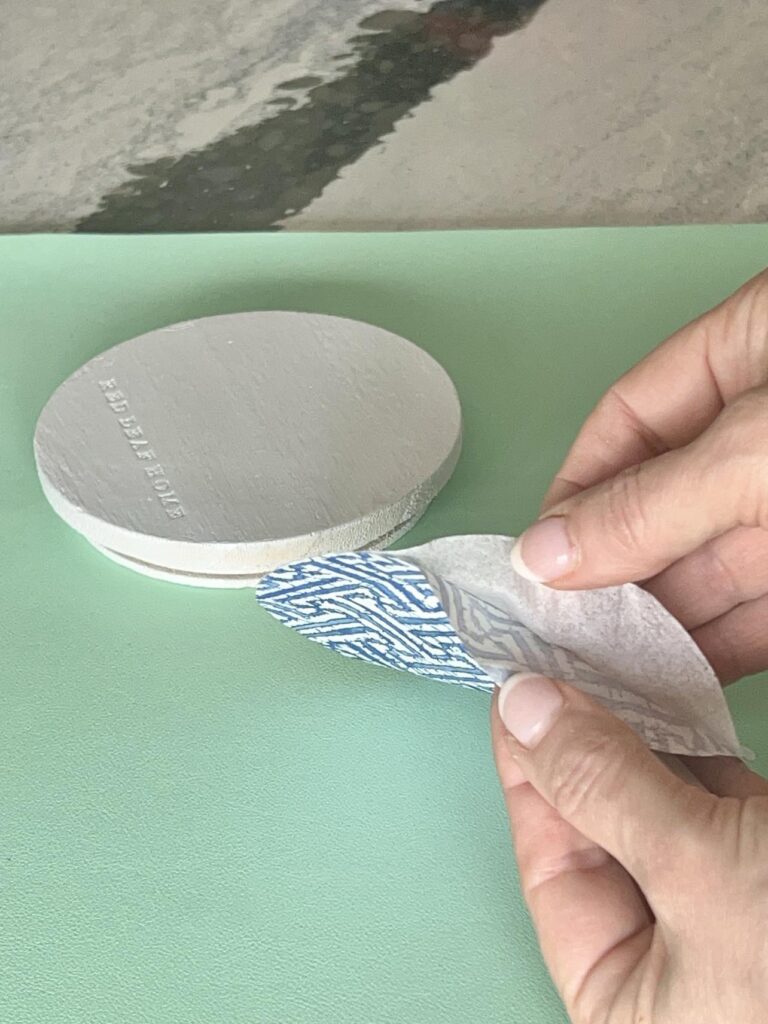 Making DIY decoupage coasters and Separating the layers of a paper napkin.
