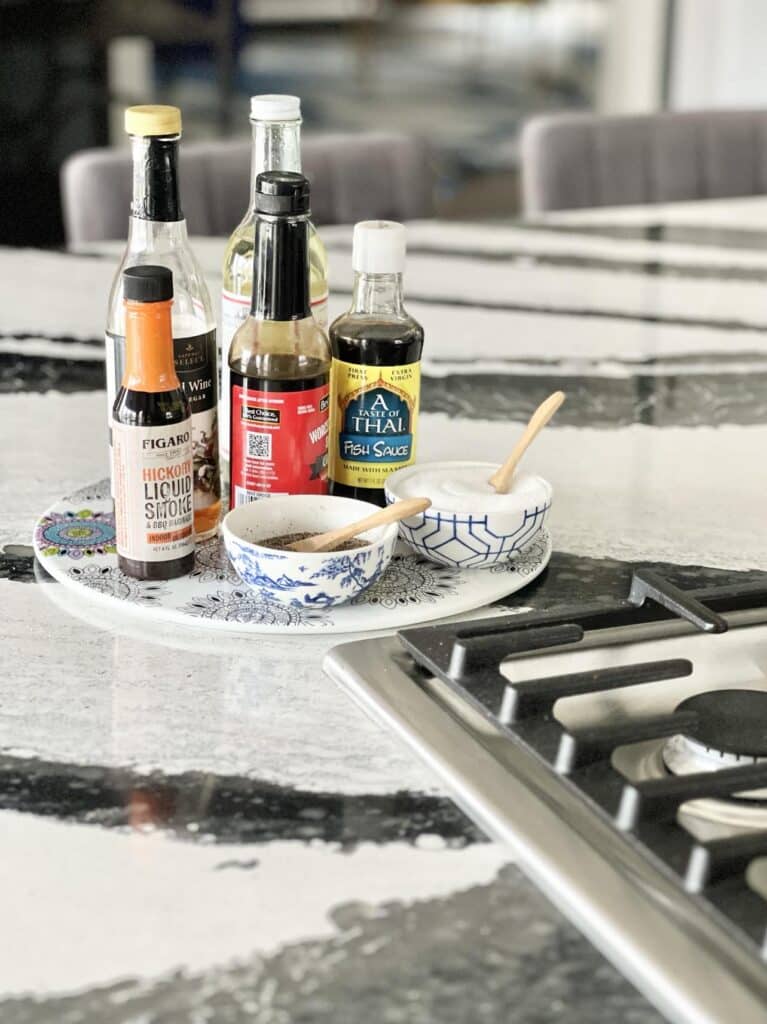 Knowing how to decorate a kitchen island is helpful when displaying these oils and vinegars on the kitchen island.