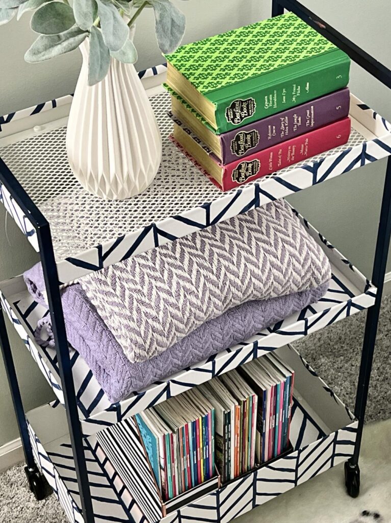 A book cart holding books and magazines for a reading nook idea in the  bedroom