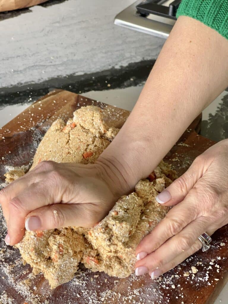 Kneading the homemade oatmeal dog treat dough.