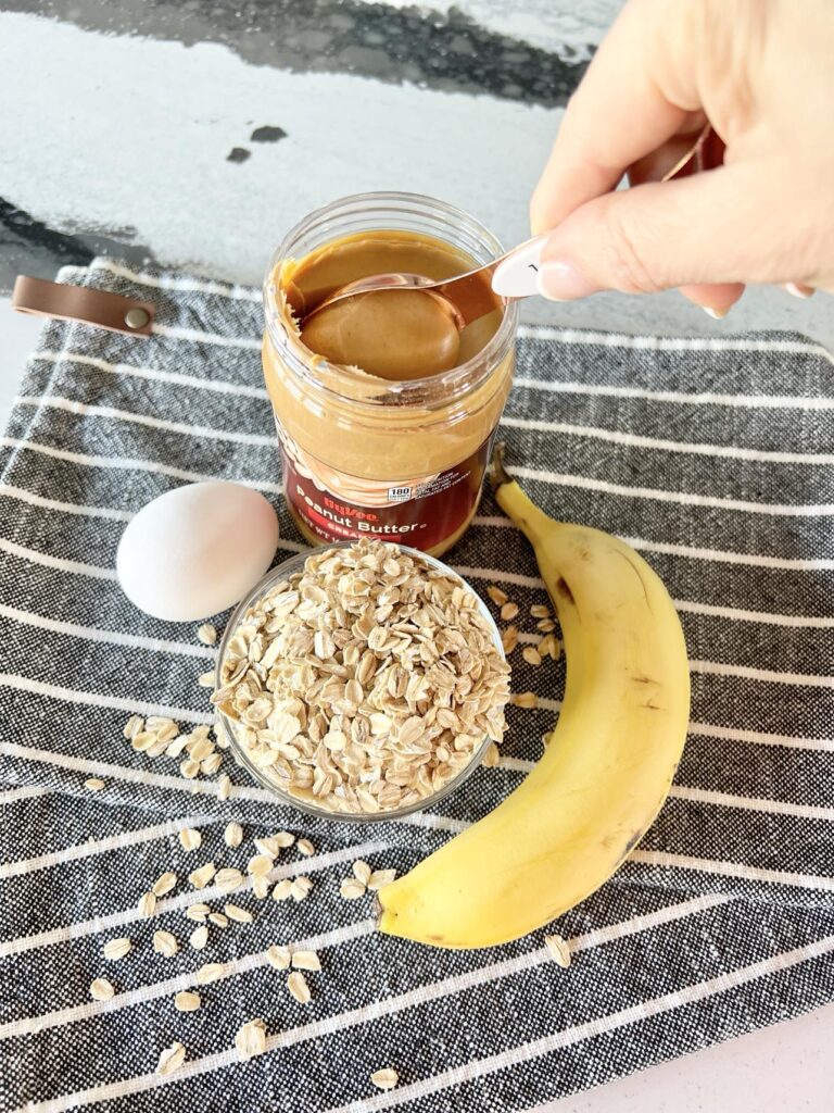 Scooping peanut butter from the jar.